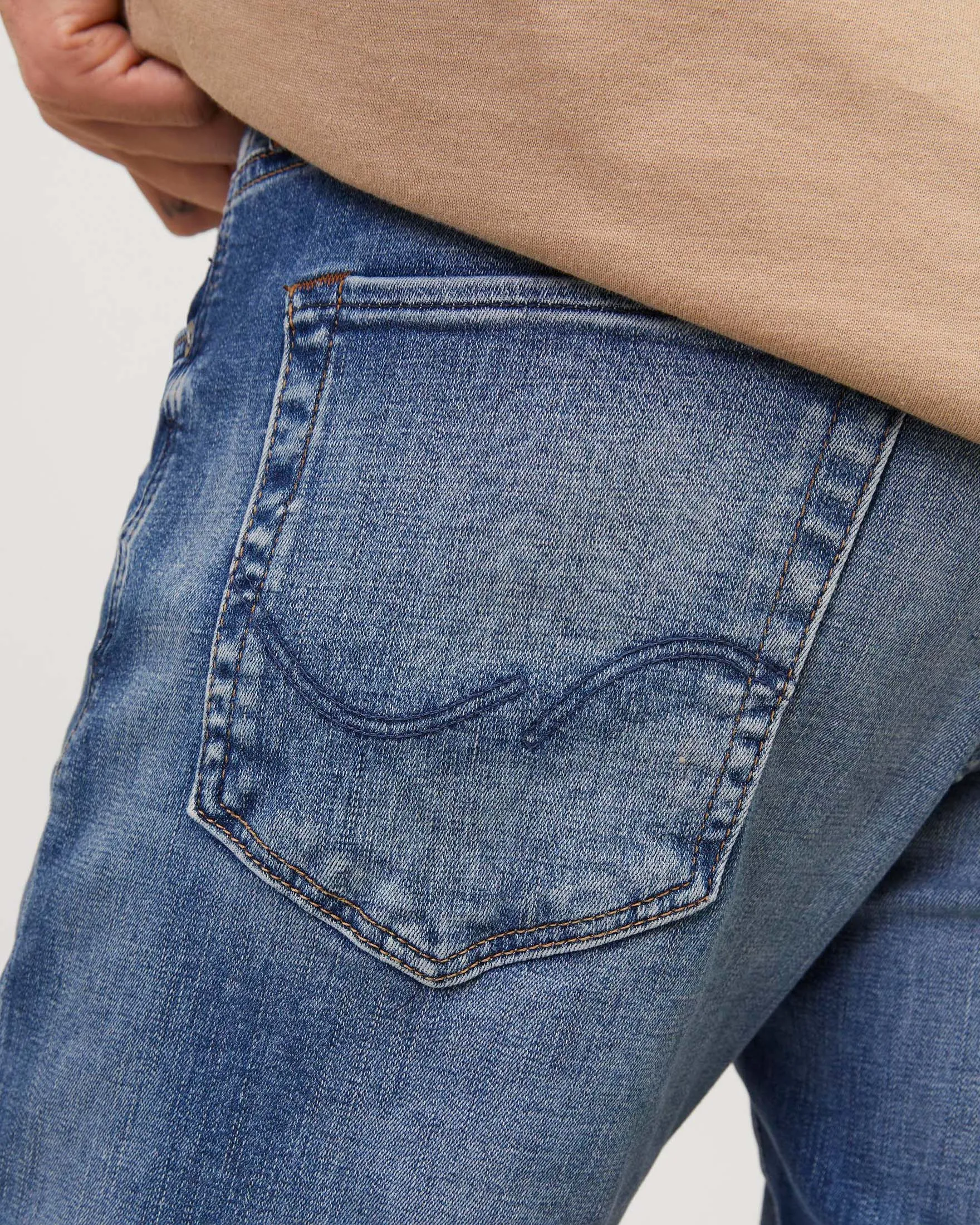 Jeans slim-fit a vita bassa in cotone stretch lavaggio chiaro con baffature e sabbiature